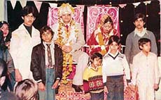 Twelve-year-old Rajiv Khanna attends the wedding of his daughter.