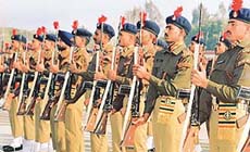Recruits of the 57th condensed course present arms during their passing-out parade held at the Indo-Tibetan Border Police Forces Basic Training Centre at Bhanu near Chandigarh on Saturday.