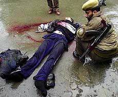 A policeman inspecting the body 