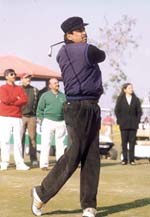 Former Indian cricket captain Kapil Dev swings to form in the Standard Chartered Invitational Golf Tournament at the DLF Golf and Country Club, Gurgaon.