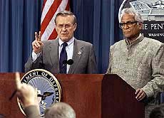US Defense Secretary Donald H. Rumsfeld and Indian Defence Minister George Fernandes meet reporters