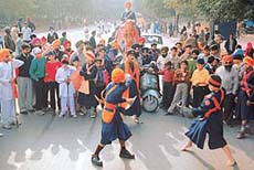 A gatka demonstration during a procession to celebrate the Guru Gobind Singh birthday, in Chandigarh on Saturday.