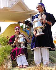 Girls with samovar (traditional kettle) on the tableau of Jammu and Kashmir at the press preview of the Republic Day parade in the Capital on Monday.