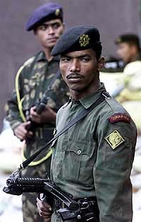 Commandos stand guard outside the US information office