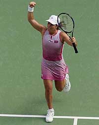 Jennifer Capriati of the U.S. celebrates after winning her semifinal against Belgium's Kim Clijsters