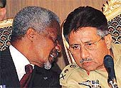 UN Secretary-General Kofi Annan whispers to Pakistan President Pervez Musharraf 