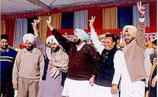 Captain Amarinder Singh and local Congress candidate Choudhary Santhok Singh at a rally in Chak Dana (Phillour).
