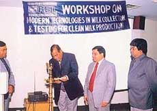The Managing Director of Milkfed, Punjab, Dr B. M. Mahajan, lights a lamp