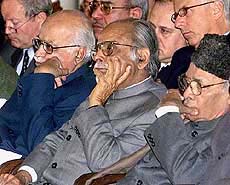 Union Home Minister L. K. Advani, former Prime Ministers I. K. Gujral and P. V. Narasimha Rao at a function