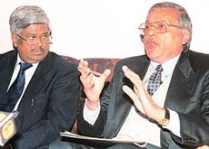 Mr R.C. Vaish, Principal General Manager Telecom (right) and Mr Deenadayalan, GM, Finance, address a press conference in Sector 18, Chandigarh, on Tuesday. 