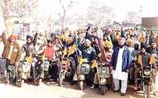 Supporters of Mr Mahesh Inder Singh Grewal, candidate of the Panthic Morcha from Kila Raipur, take out a scooter rally in the constituency on Tuesday.