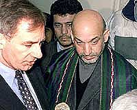 British Defence Secretary Geoff Hoon (left) talks to the media as Afghanistans interim leader Hamid Karzai listens