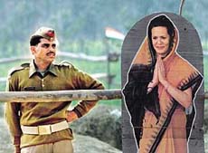 A policeman stands beside a life-size poster of Sonia Gandhi, President of the Congress.