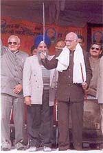The Union Home Minister, Mr L. K. Advani, waves a sword during a rally at Jalandhars Partap Bagh on Friday.