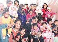 Participants with their parents at a healthy baby contest in Chandigarh on Sunday. 