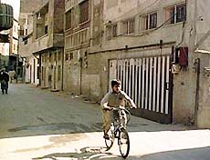 A boy rides a bicycle