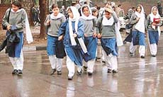 Students brave the icy winds and showers