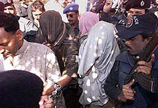 The Pakistani police escort suspects