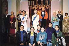 Students pose for a photograph at Madam Tussauds Wax Museum in London.