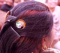 A BJP supporter uses the party logo as hairpin in Amritsar on Tuesday.