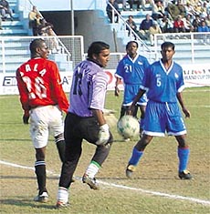 Players of Mahindra United, (Red) and ITI(Blue)during the Durand Cup Football Tournament in the Capital.