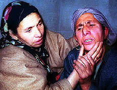 Women break down beside the body of a Rawalpora Srinagar youth who was shot dead in clod blood