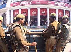 Delhi Police keep a vigil outside Wimpy restaurant at Cannaught Place, in view of the anti-Valentines Day protest by the Shiv Sena