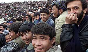 Afghan soccer fans watch the match.