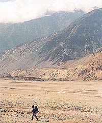 A lone trekker in the wilds of the Kali Gandaki valley.