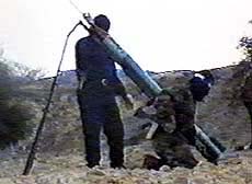 Hamas members as they prepare to fire a Qassam-2 rocket