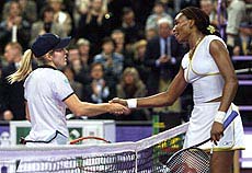 USA's Venus Williams shakes hands with Belgium's Justine Henin