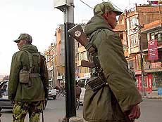 Royal Nepalese Army soldiers patrol a street in the capital Kathmandu