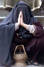 A Kashmiri woman offers prayers to celebrate the birth of 14th century Sufi Saint Mir Syed Ali Hamdani in Srinagar