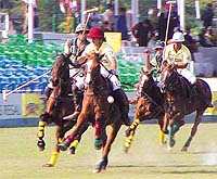 McDowell Signature (Green) and Jindal/Royal Kashmir (Yellow) vie for the ball at the Jaipur Polo Ground in the Capital.