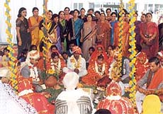 The members and office-bearers of the Lioness Club (Faridabad Central) with the couples during the wedding ceremony