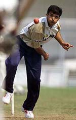 Indias captain Saurav Ganguly bowls to a teammate during a practice session