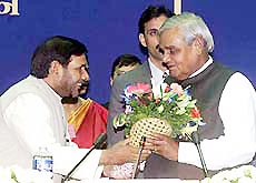 Prime Minister Atal Behari Vajpayee being greeted by Labour Minister Sharad Yadav