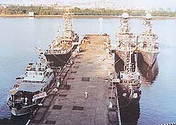 Line-up of Indian Naval ships on Mumbai dockyard breakwater during the crucial three days of the Rin Mutiny.