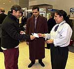 Oscar-nominated Bollywood film Lagaans actor and producer Aamir Khan gives autograph to his fans on his arrival in New York on Friday.