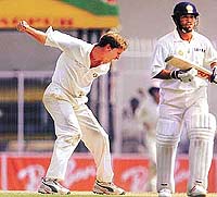 Zimbabwe's Raymond Price celebrates after taking the wicket of India's Sachin Tendulkar