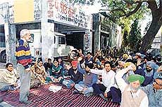Employees of the Punjab Health Department Subordinate Officers Clerical Association protest against the transfer of district president, Mr Sukhwinder Singh, in Ludhiana on Monday.