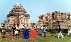 Clothes are seen drying on the stone carves