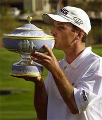 Kevin Sutherland kisses the trophy