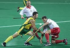 Australia's Troy Elder clashes with Poland's Tomasz Spalek