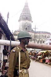 A securityman positioned at an approach road leading to the disputed site in Ayodhya