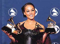 Singer Alicia Keys poses with the five Grammy Awards