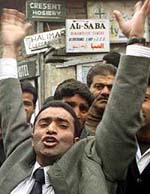 A Kashmiri lawyer shouts anti-government slogans 
