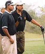 The Haryana Hurricane discussing the finer points of golf.