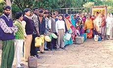 Queuing up for kerosene at the Sector 29 Ajay filling station in Chandigarh on Monday.