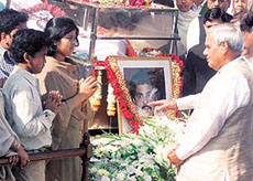 Prime Minister Atal Behari Vajpayee consoles the children